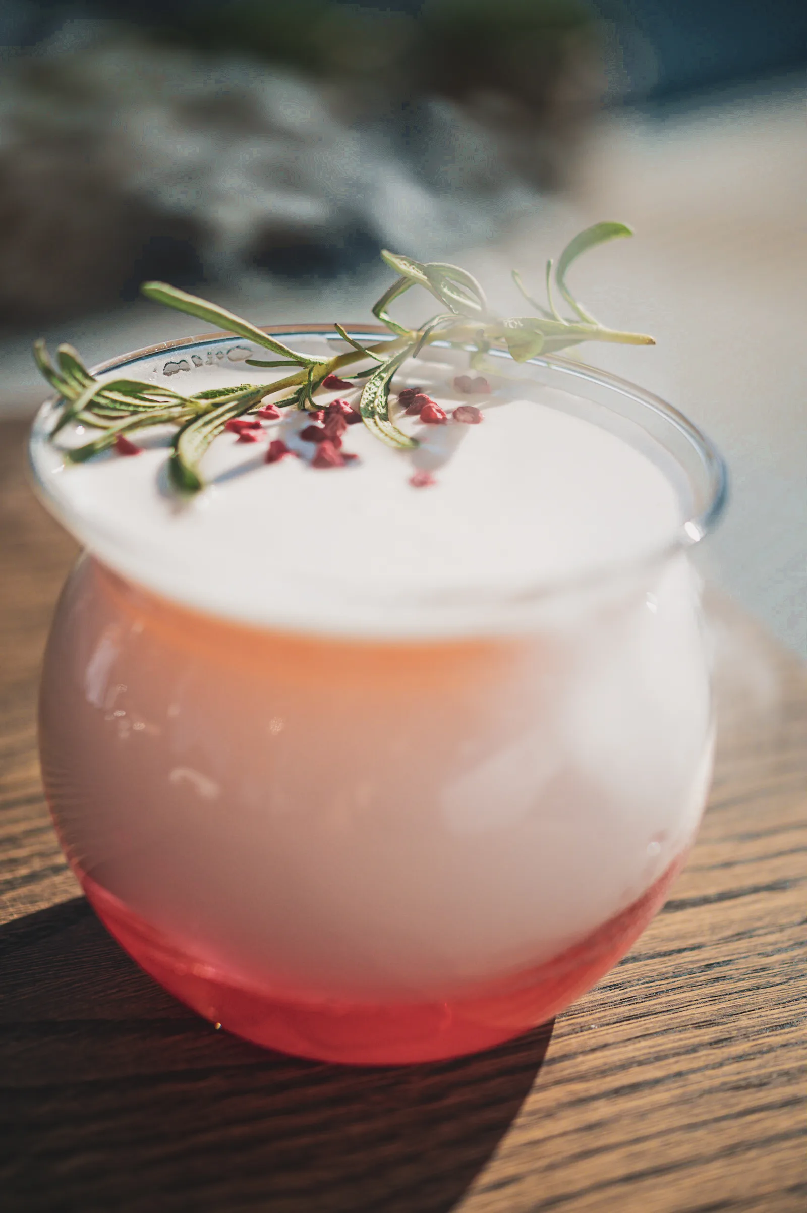 A sour with rosemary and pink pepper in low sun
